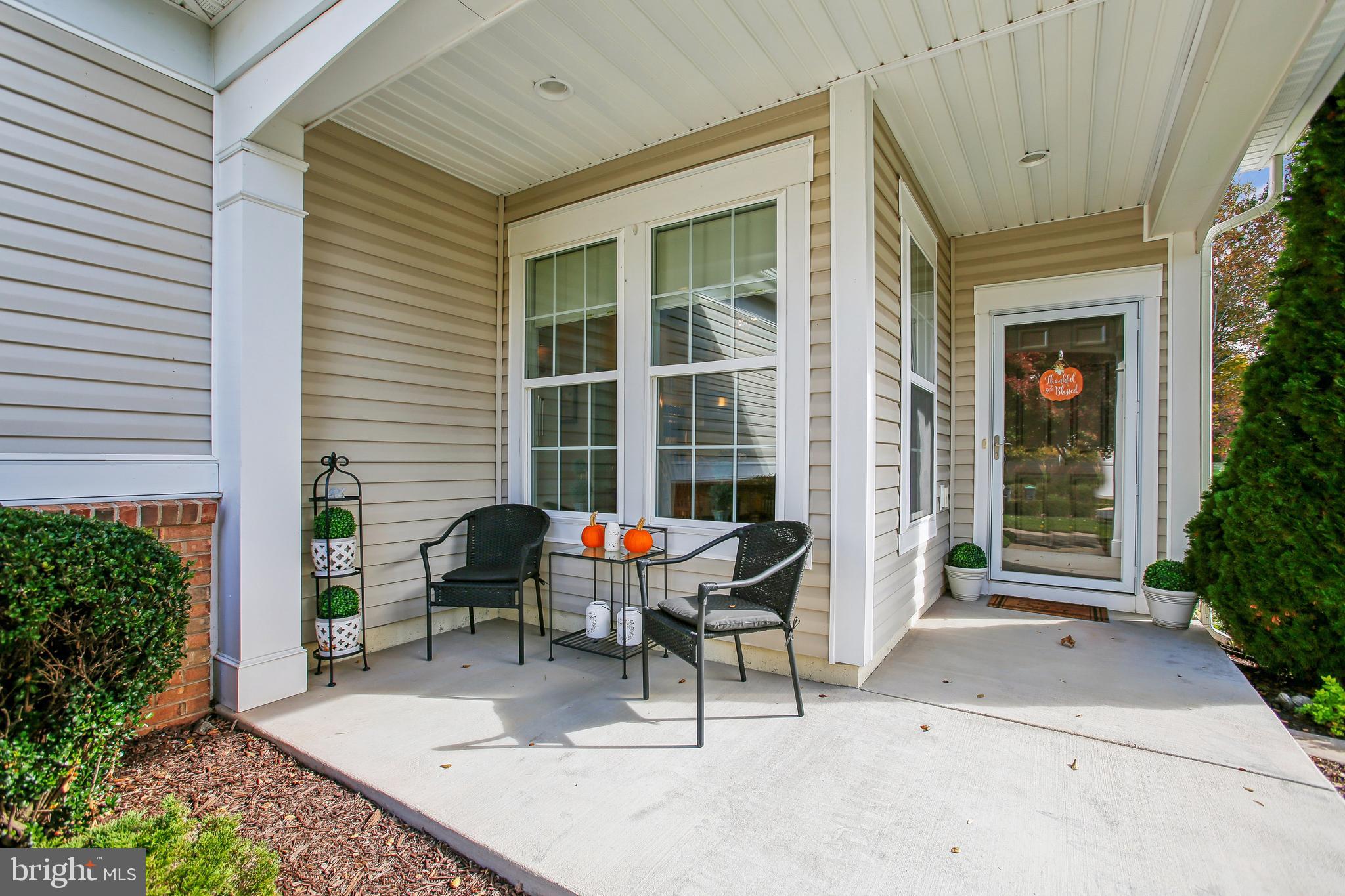 187 Denison Street Fredericksburg, VA 22406 - Photo 4 of 40 a view of a patio with table and chairs and potted plants