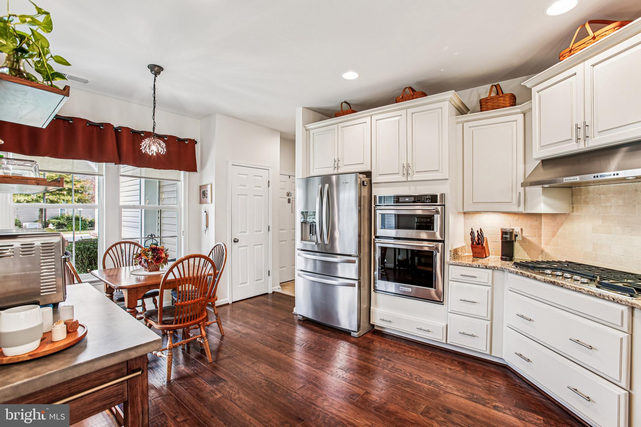 187 Denison Street Fredericksburg, VA 22406 - Photo 8 of 40 a kitchen with stainless steel appliances granite countertop a stove refrigerator and cabinets