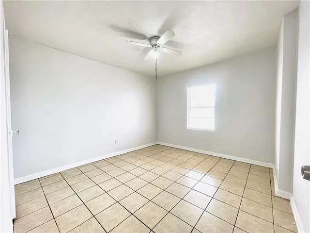 a bathroom with a toilet sink vanity and shower
