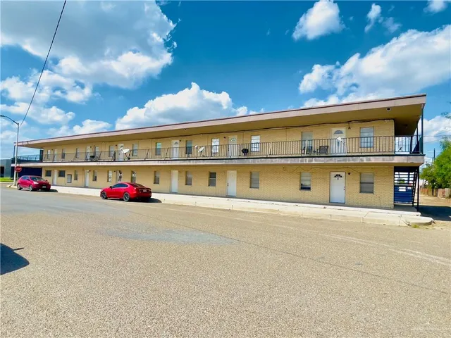 a kitchen with stainless steel appliances a stove sink and cabinets