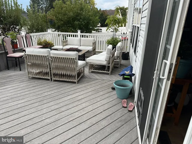 a view of roof deck with furniture