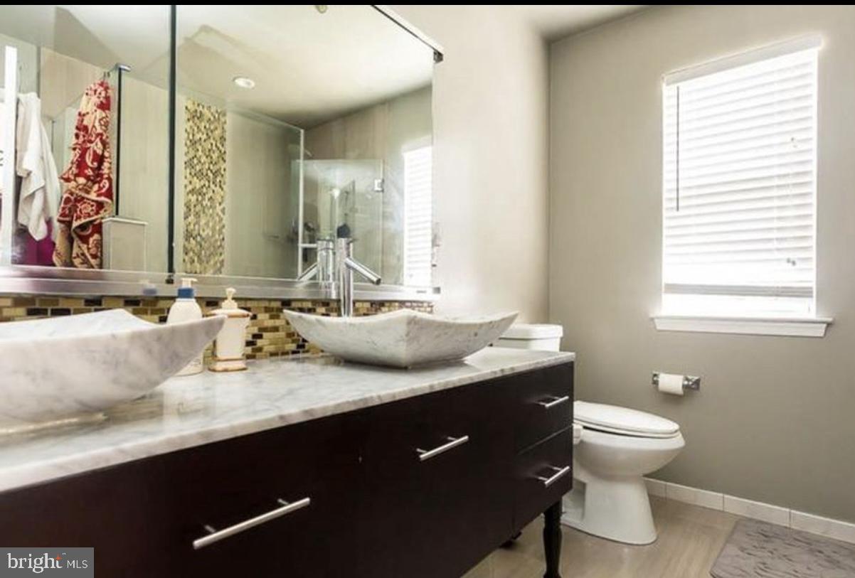 12 Murray Way Blackwood, NJ 08012 - Photo 45 of 46 a bathroom with a granite countertop sink a toilet and a mirror