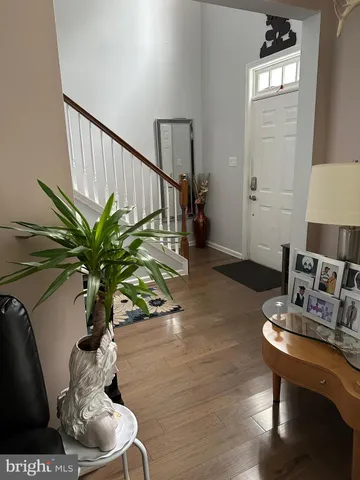 a vase of flowers sitting on a table with chairs