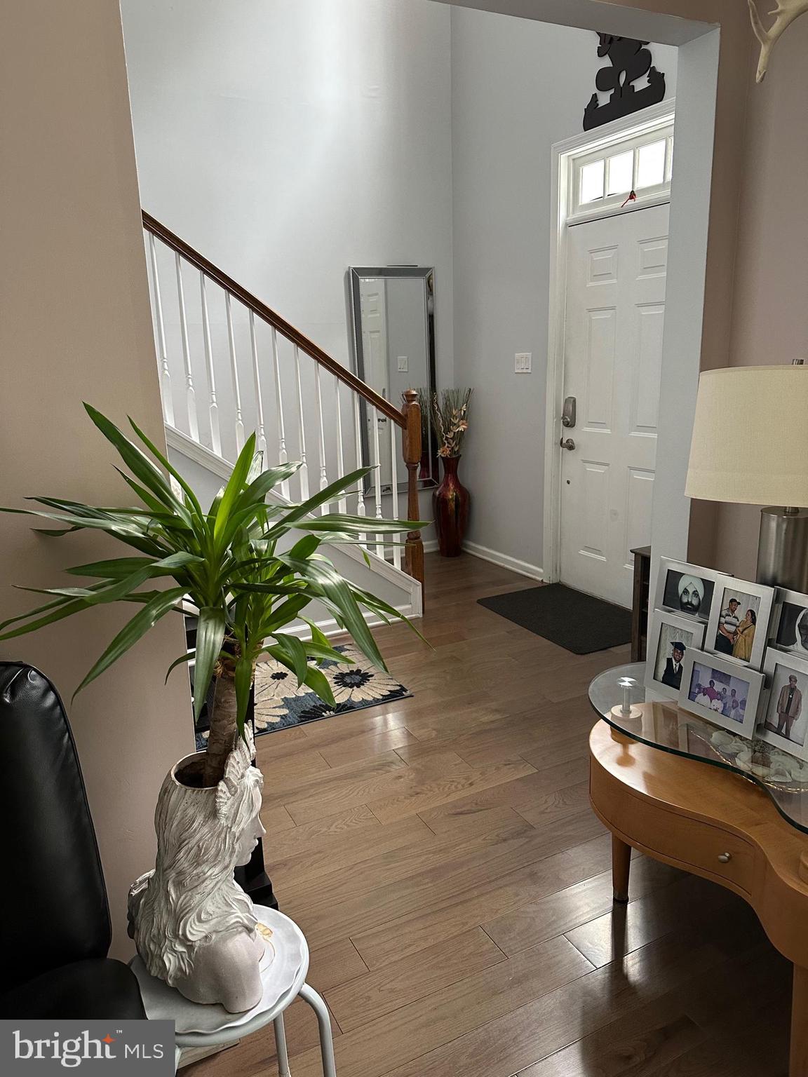 12 Murray Way Blackwood, NJ 08012 - Photo 7 of 46 a vase of flowers sitting on a table with chairs