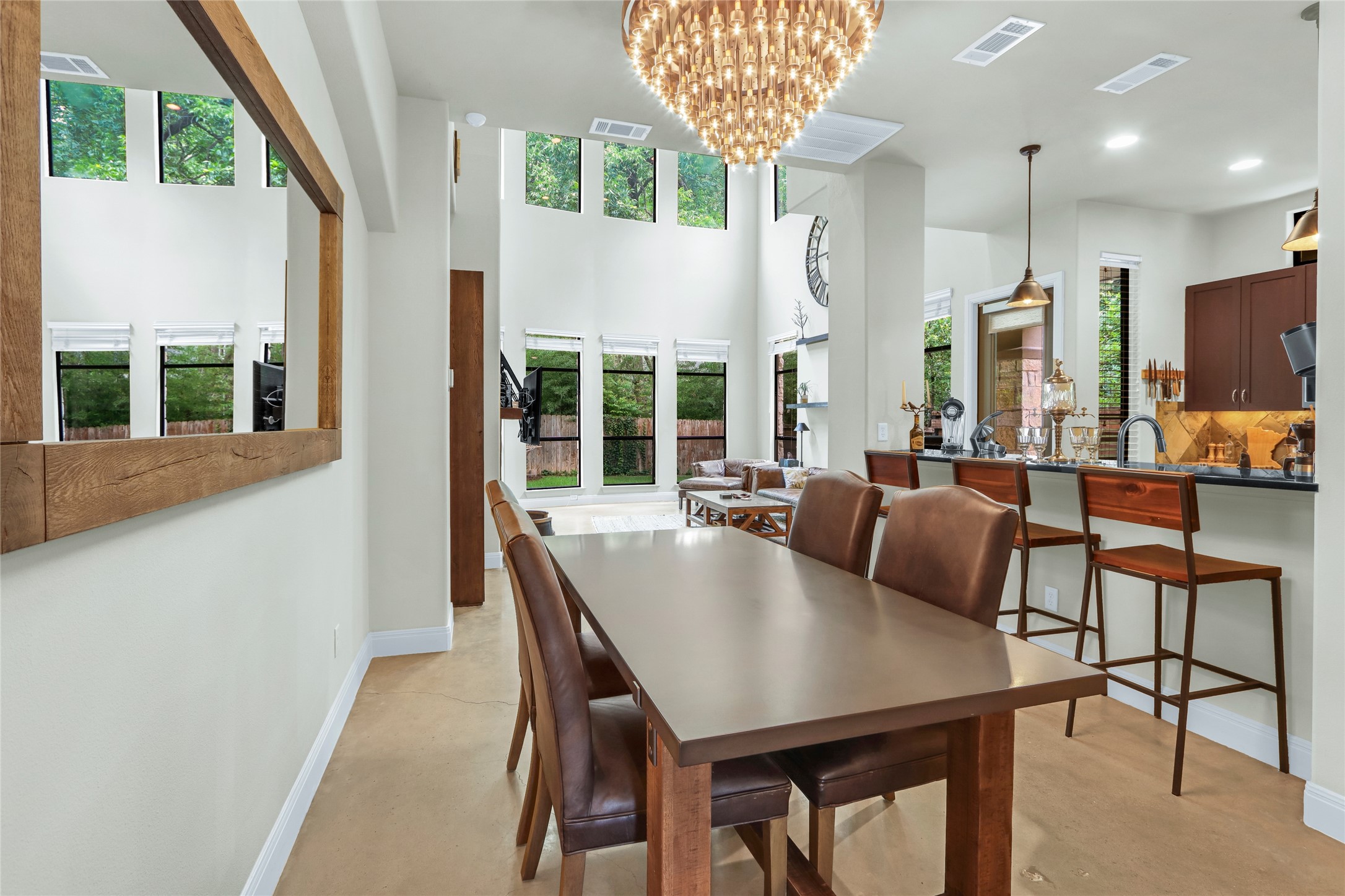 2312 Thornton Road, Unit B Austin, TX 78704 - Photo 1 of 1 Dining room featuring baseboards, a chandelier, recessed lighting, and finished concrete flooring
