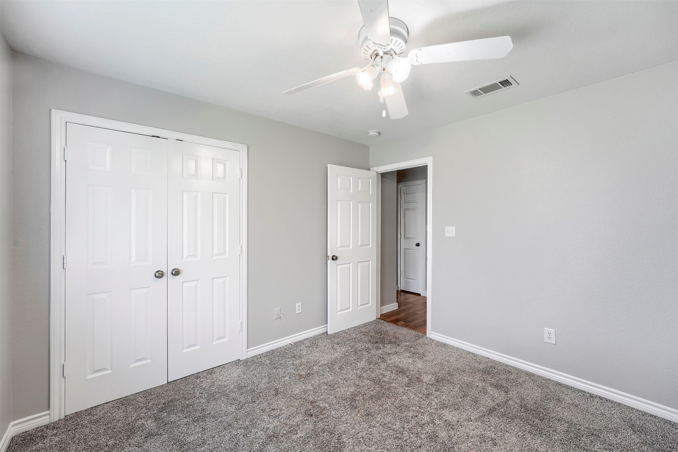1105 2nd Street Jarrell, TX 76537 - Photo 16 of 27 An airy bedroom with fresh carpet and a convenient closet awaits your personal touch.