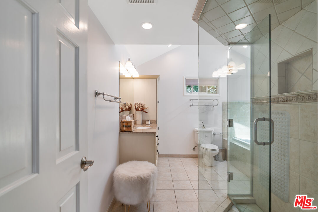 99 Paradise Cove Road Malibu, CA 90265 - Photo 11 of 26 a bathroom with a sink and mirror