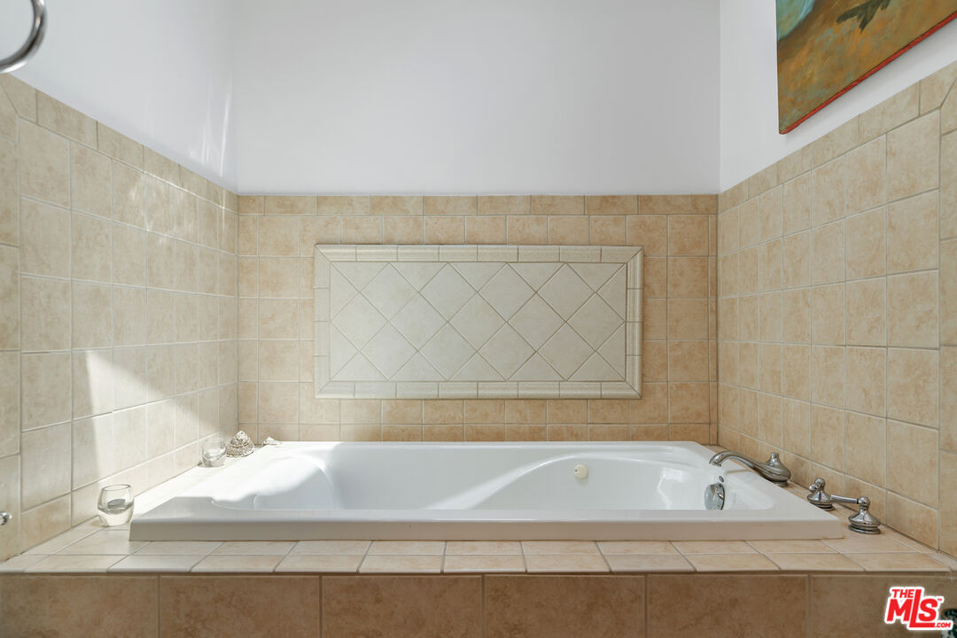 99 Paradise Cove Road Malibu, CA 90265 - Photo 13 of 26 a bathroom with a bathtub and shower