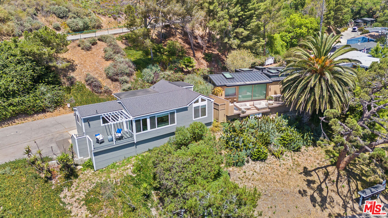 99 Paradise Cove Road Malibu, CA 90265 - Photo 16 of 26 front view of a house with a yard