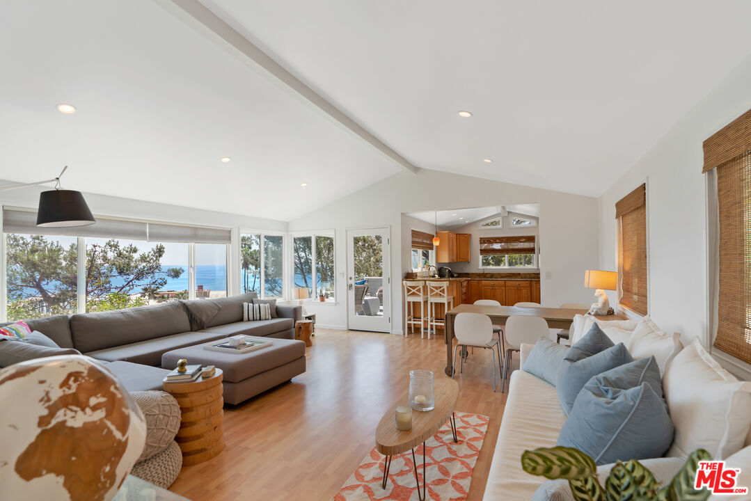 99 Paradise Cove Road Malibu, CA 90265 - Photo 2 of 26 a living room with furniture and a large window