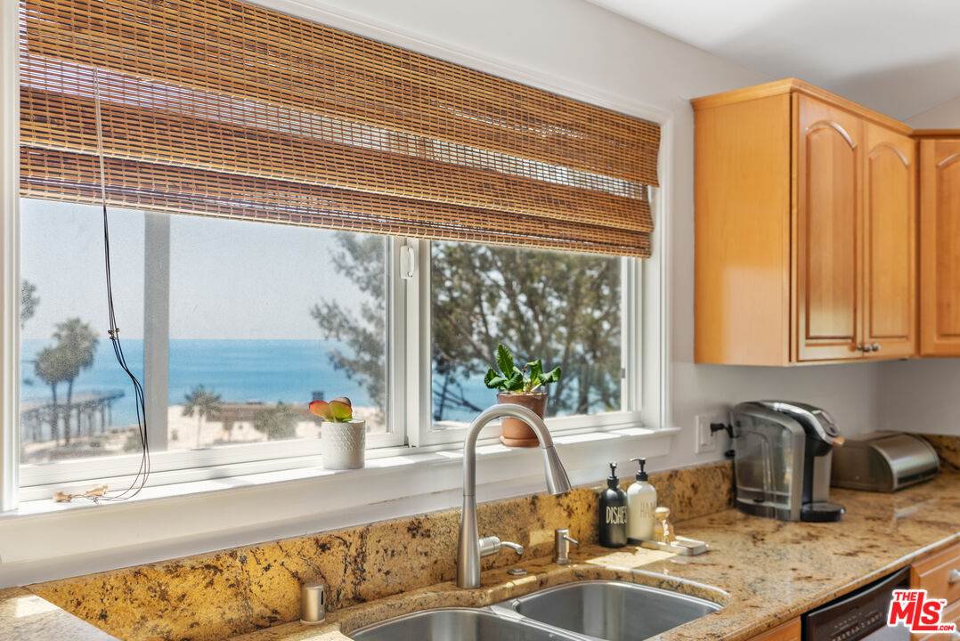 99 Paradise Cove Road Malibu, CA 90265 - Photo 6 of 26 a kitchen with a window a sink and a counter top space