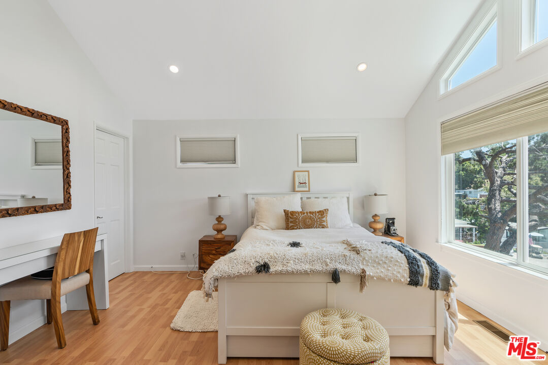 99 Paradise Cove Road Malibu, CA 90265 - Photo 8 of 26 a bed sitting in a bedroom next to a window
