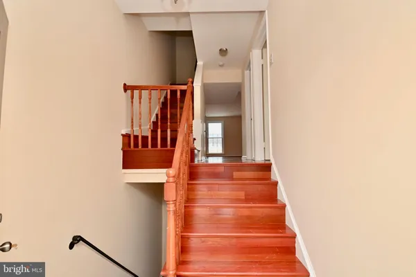 a view of staircase with white walls