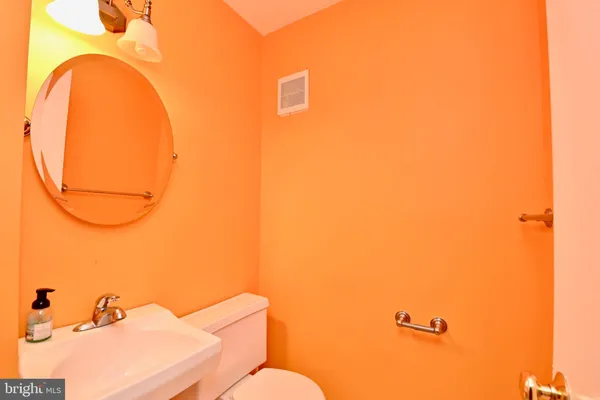 a bathroom with a sink and mirror