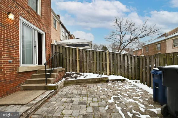 a backyard of a house with barbeque oven
