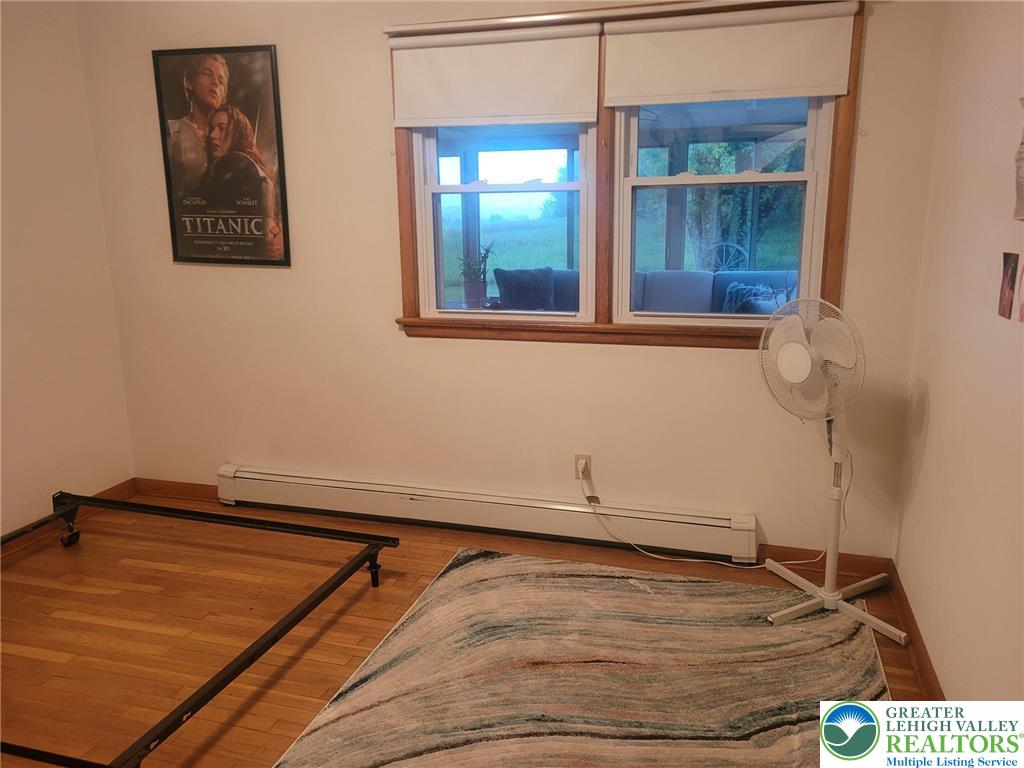 889 Bushkill Center Road Nazareth, PA 18064 - Photo 21 of 31 a room with a wooden floor and a window