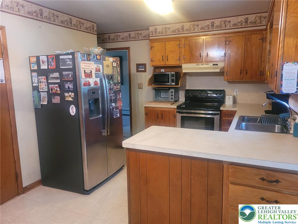 889 Bushkill Center Road Nazareth, PA 18064 - Photo 10 of 31 a kitchen with stainless steel appliances a refrigerator and a stove