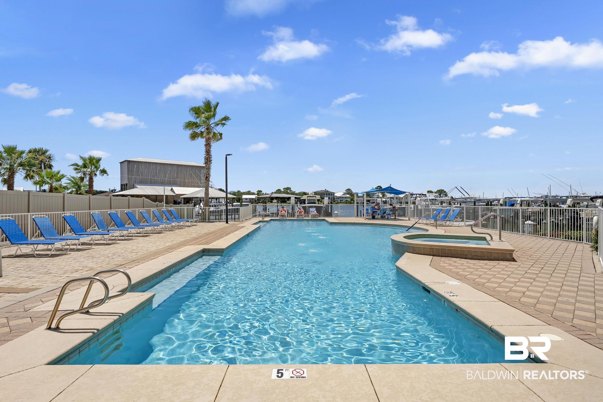 28250 Canal Road, Unit 307 Orange Beach, AL 36561 - Photo 8 of 56 Community pool featuring a patio and a community hot tub
