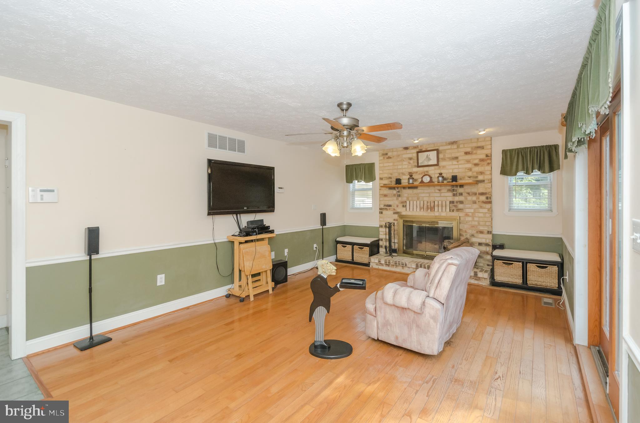 869 Swift Road Pasadena, MD 21122 - Photo 22 of 68 Family Room is very large and has wood Fireplace