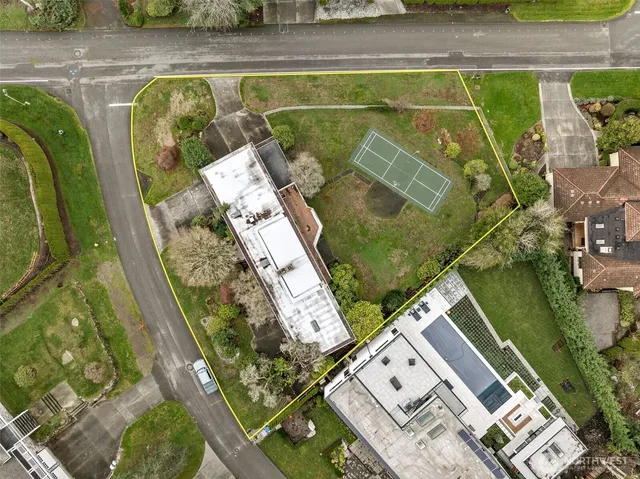 a front view of house with a yard and outdoor seating