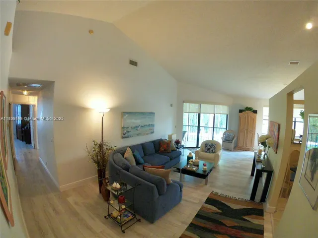 a bathroom with a sink mirror and toilet