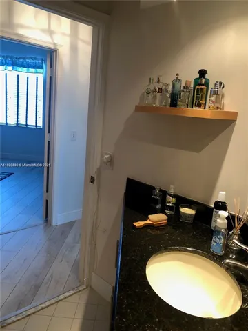 a living room with furniture and a walk in closet