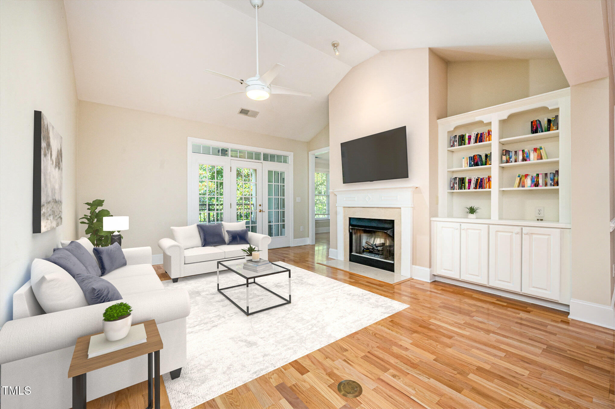 Large living room w/beautiful hardwoods, fireplace & catheral ceilings