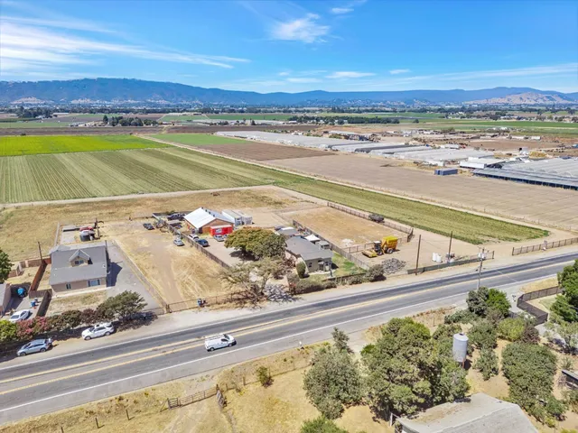 a view of a swimming pool with a lake and mountain view