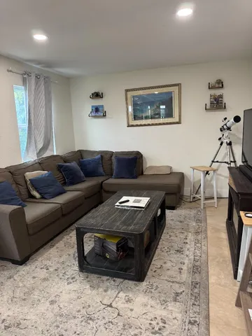 a kitchen with stainless steel appliances granite countertop a stove sink and cabinets