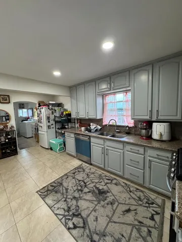 a bathroom with a sink toilet and mirror