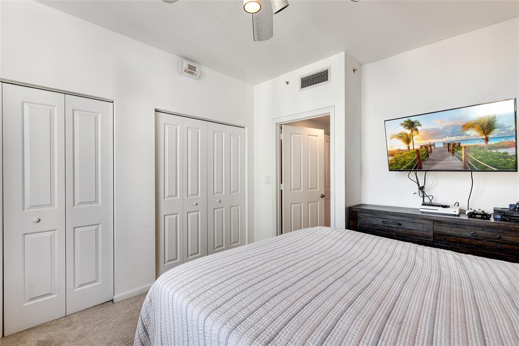 511 Southeast 5th Avenue, Unit 1602 Fort Lauderdale, FL 33301 - Photo 18 of 66 a bedroom with a bed and a flat tv screen on dresser