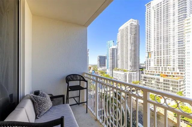 a kitchen with a sink a stove and cabinets