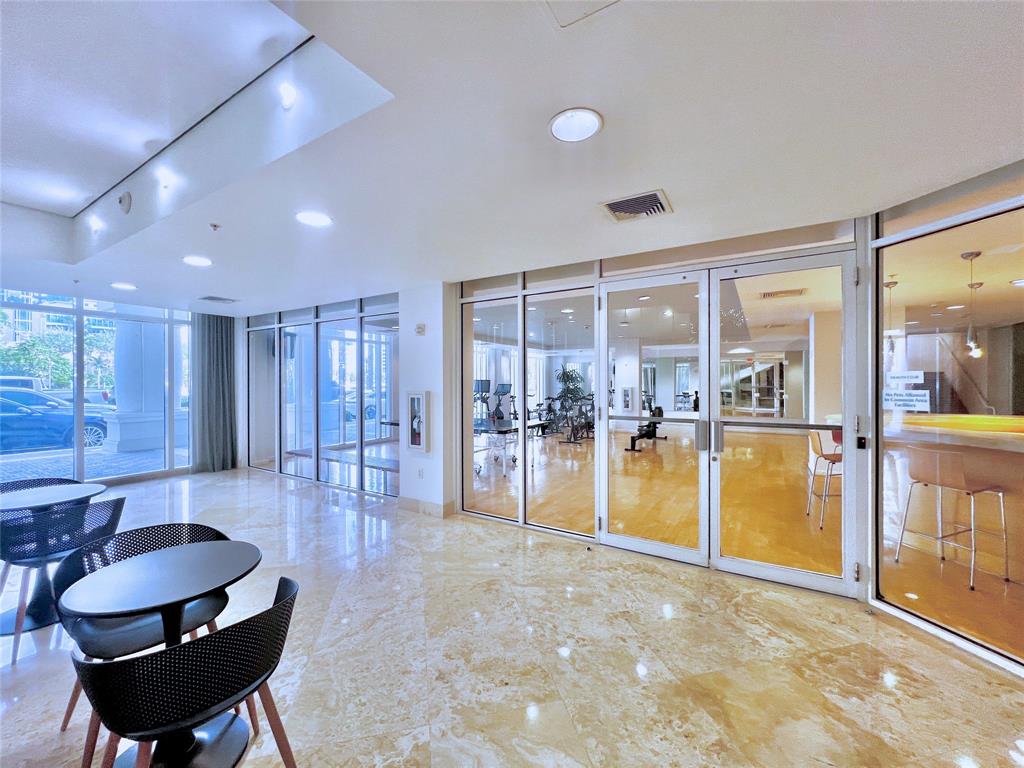 511 Southeast 5th Avenue, Unit 1602 Fort Lauderdale, FL 33301 - Photo 42 of 66 a lobby with furniture and a table