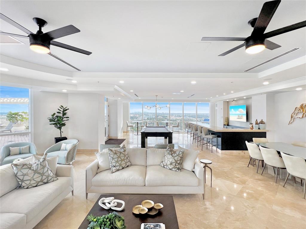 511 Southeast 5th Avenue, Unit 1602 Fort Lauderdale, FL 33301 - Photo 47 of 66 a living room with furniture and a fireplace