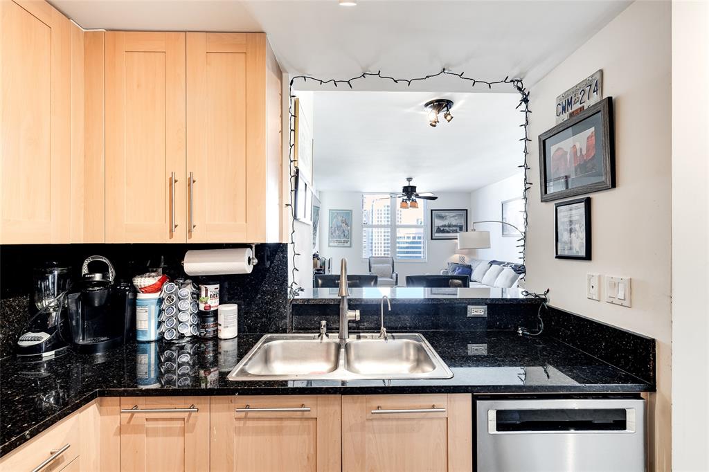 511 Southeast 5th Avenue, Unit 1602 Fort Lauderdale, FL 33301 - Photo 6 of 66 a kitchen with a sink stove and cabinets