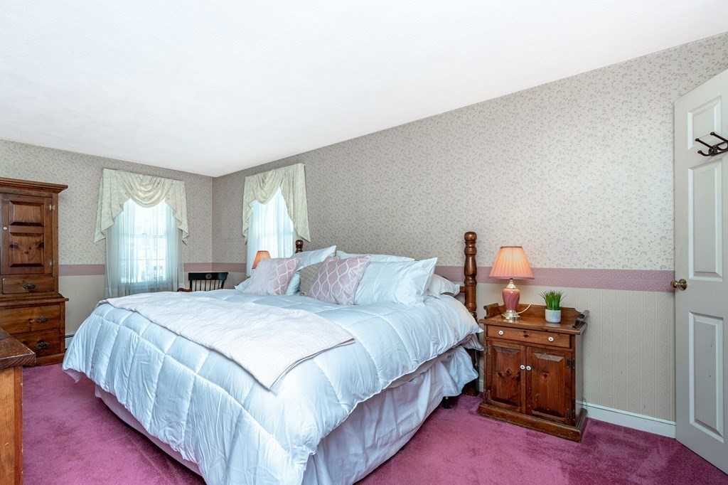 113 Gayland Road Needham, MA 02492 - Photo 12 of 32 a bedroom with a bed and wooden floor