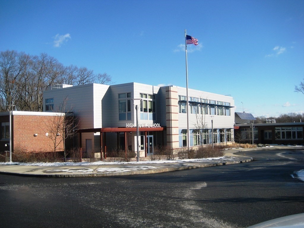 113 Gayland Road Needham, MA 02492 - Photo 29 of 32 a front view of a building with street view and trees