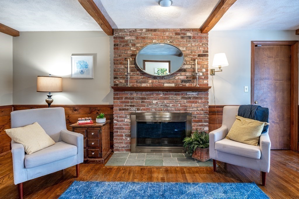 113 Gayland Road Needham, MA 02492 - Photo 8 of 32 a living room with furniture and a fireplace