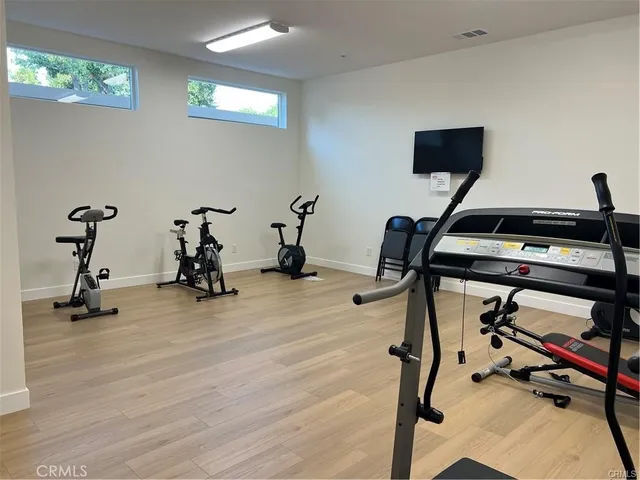 a view of a dinning table and chairs in the patio