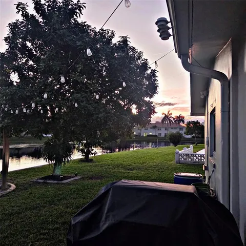 a view of yard with outdoor seating and green space