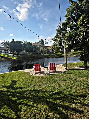 a view of a lake with a house in the background