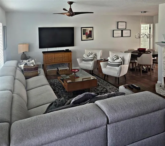 a living room with furniture and a flat screen tv