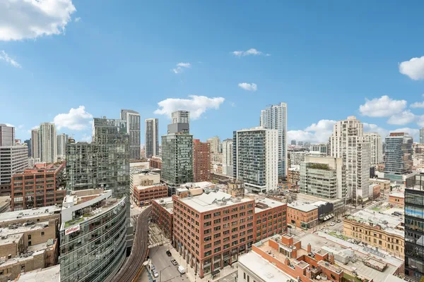 a view of city with tall buildings