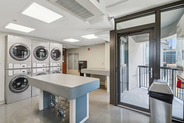 a kitchen with a refrigerator a stove and cabinets