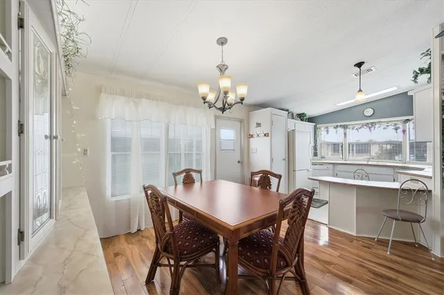 a kitchen with cabinets and outdoor view