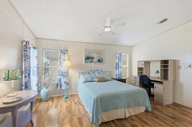 a bathroom with a double vanity sink mirror double and bathtub