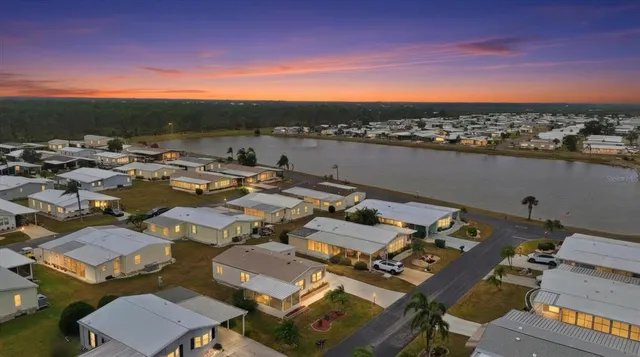 an aerial view of a houses with city view