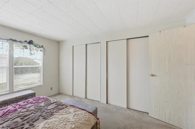 a bathroom with a granite countertop sink and a shower