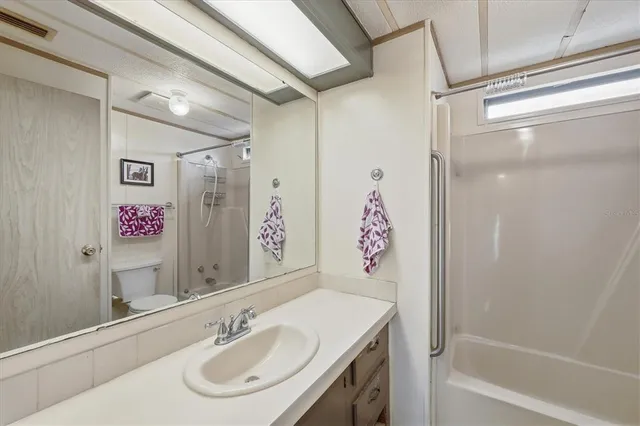 a dining room with furniture and a garden