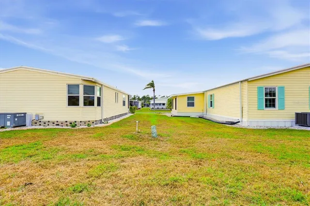 a dining room with furniture and floor to ceiling window